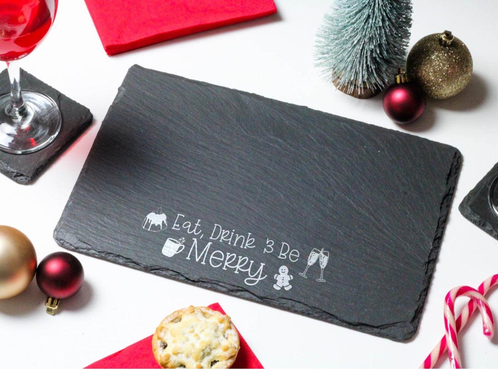 Welsh slate rectangle cheeseboard with the words 'Eat Drink and Be Merry' engraved