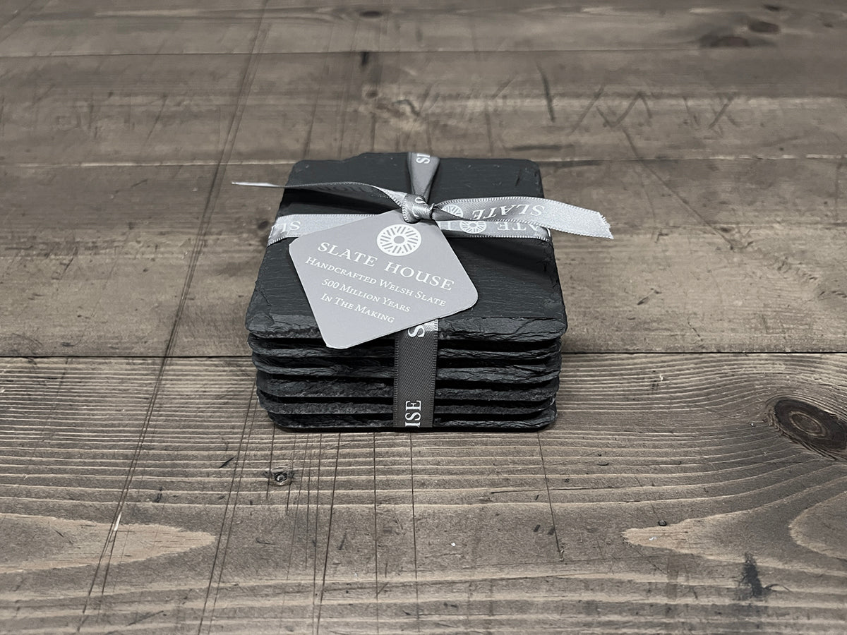 A pack of 6 hand-cut square Welsh slate coasters tied with 'Slate House' ribbon