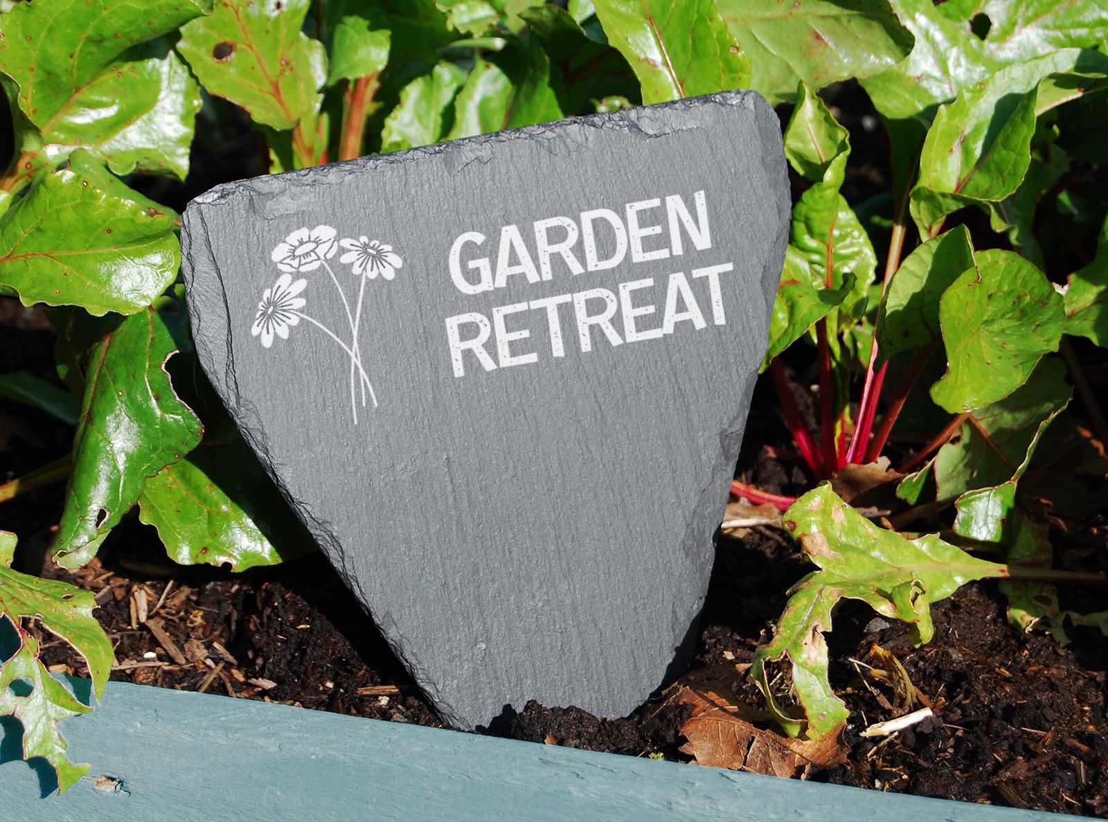 hand cut welsh slate garden marker engraved with 'Garden retreat'