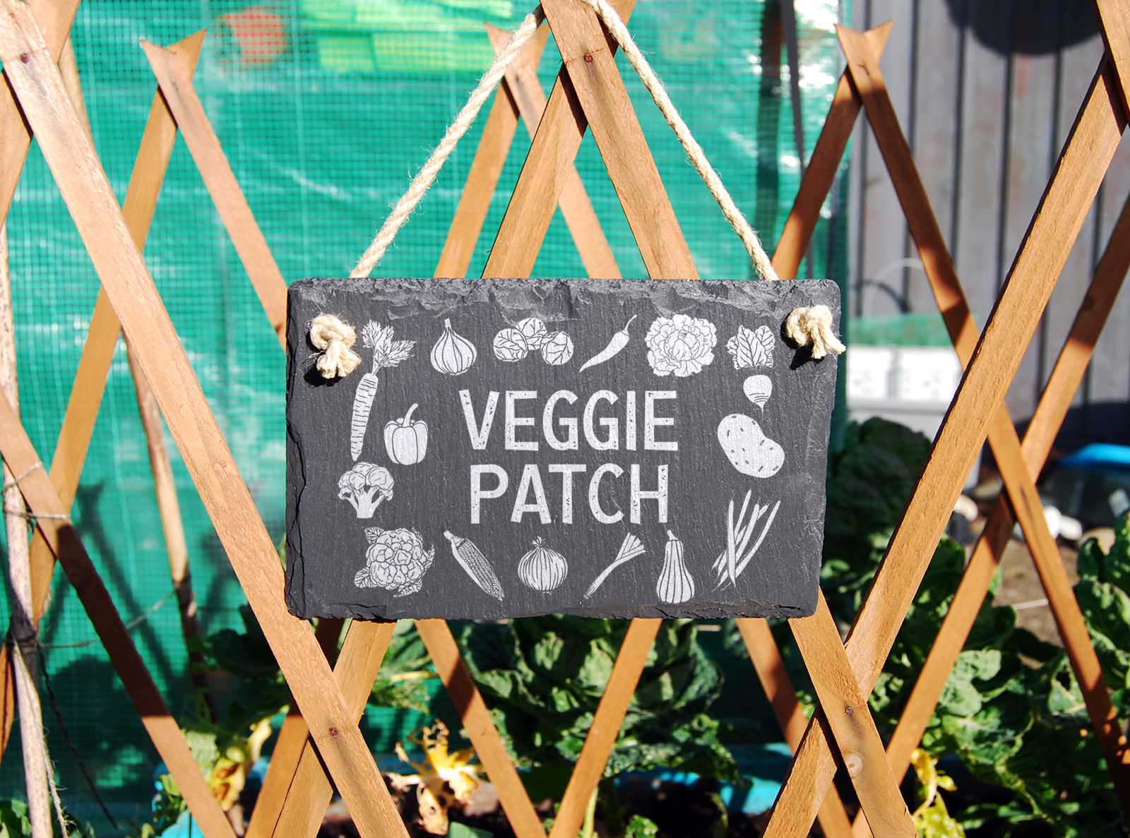 hand cut welsh slate hanging garden sign, engraved with 'veggie patch'