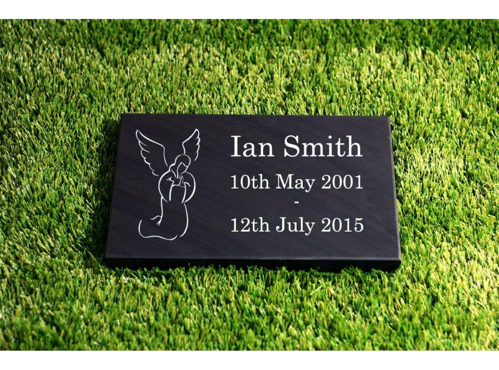A 200mm x 300mm Welsh slate flat memorial that lays on the ground, sentimental words deep engraved and colour filled on it