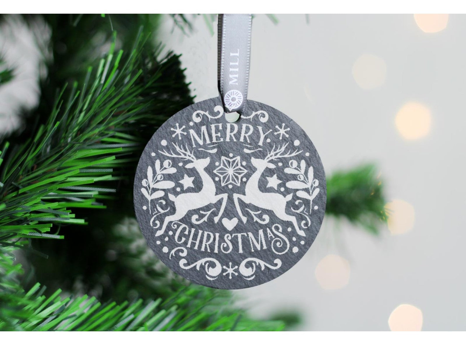 Round welsh slate christmas tree decoration with the saying 'Merry Christmas'