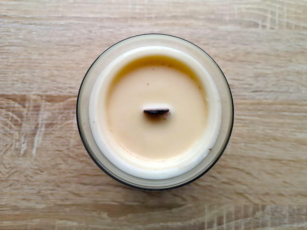 Example of a Slate House wood wick candle that is tunneling