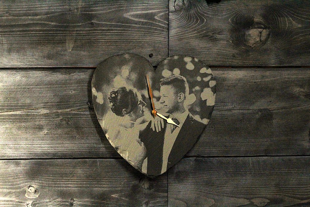 The beautiful wedding couple captured forever in Welsh slate with this unique heart clock gift.