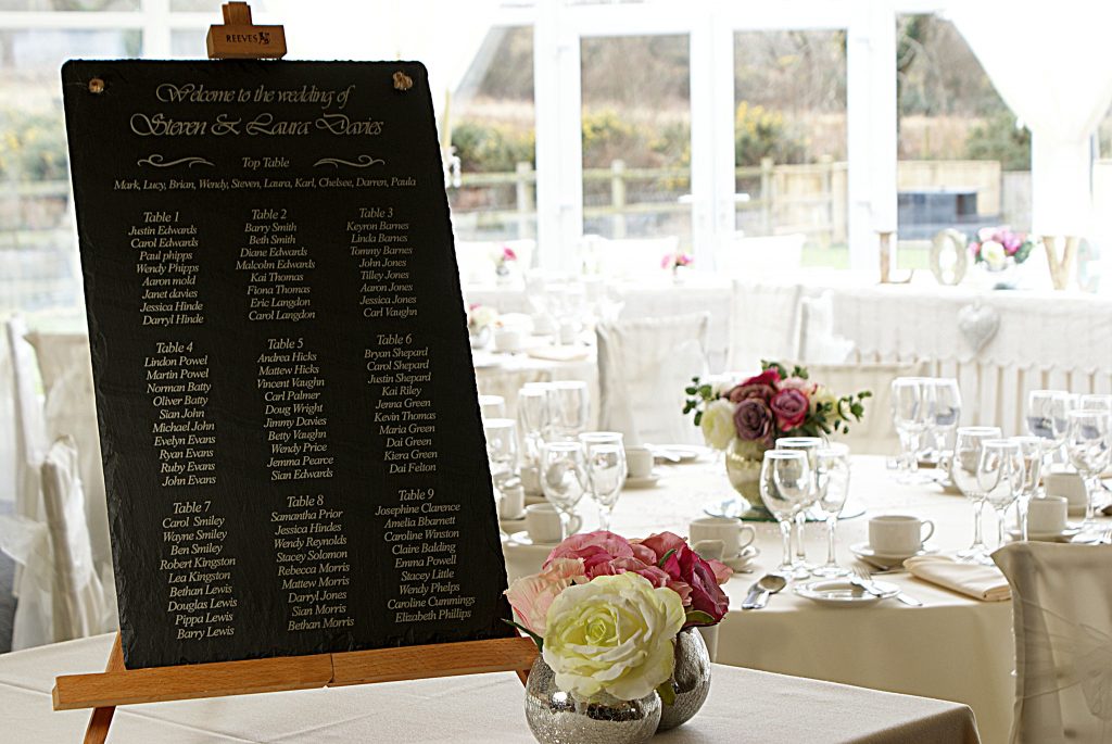 A beautiful Welsh slate table planner greets the guests at the venue