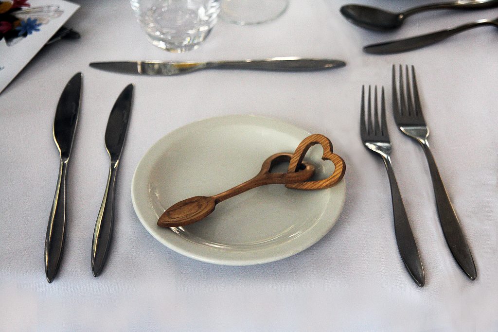 Small handcrafted Welsh love spoon given as a gift at a wedding