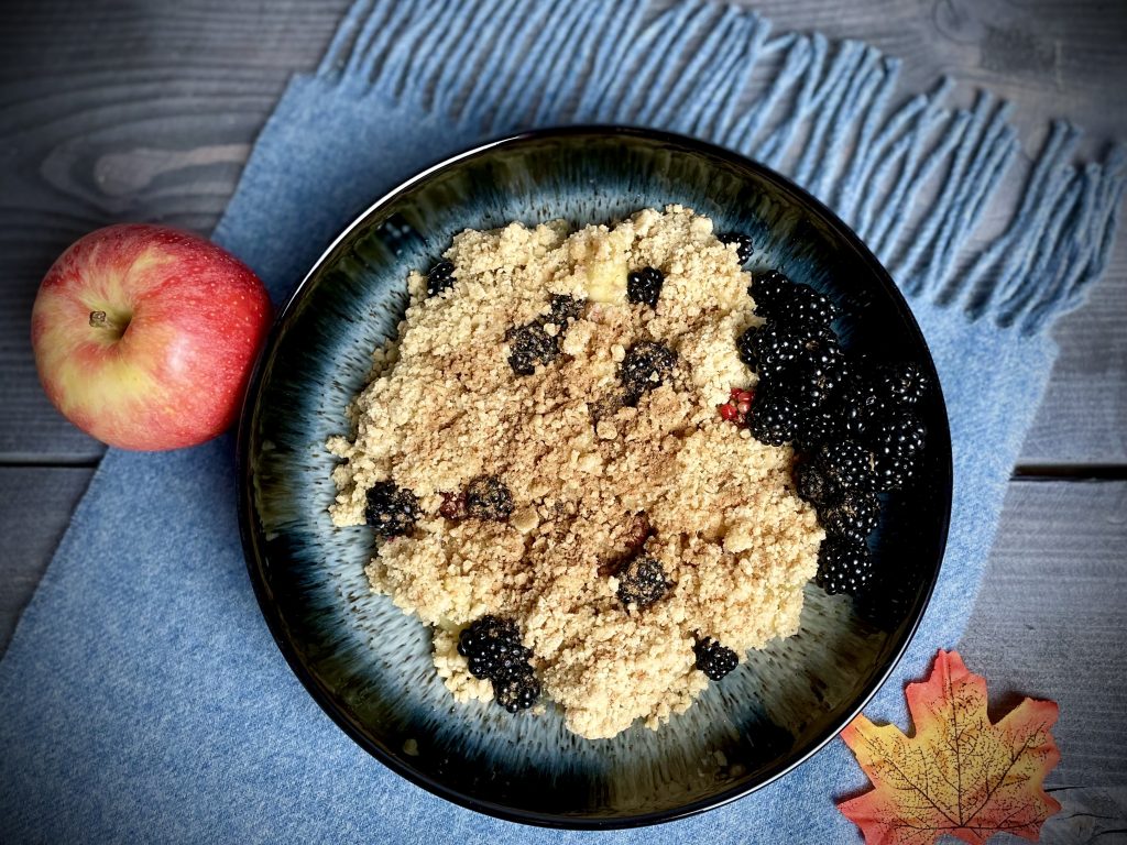 blackberry and apple crumble served in a denby halo bowl