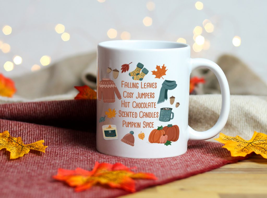 white ceramic mug with the words falling leave, cosy jumpes, hot chocolate and more autumn inspired things