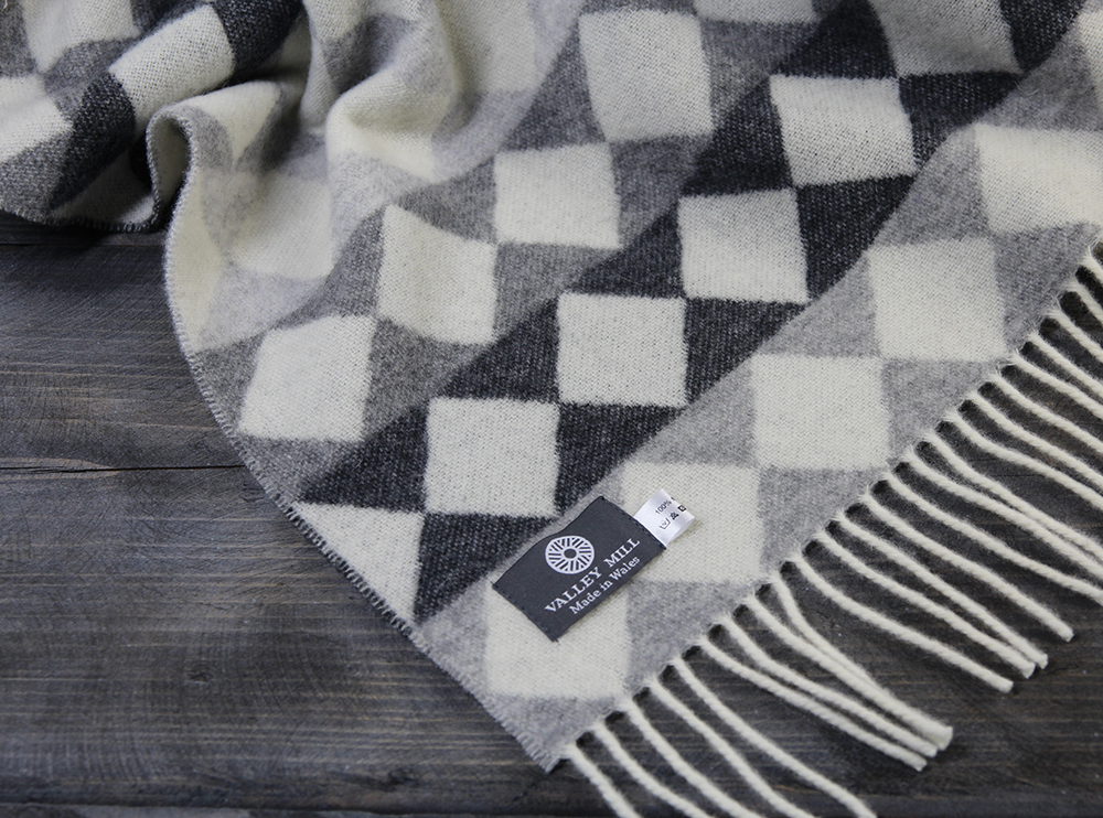 Merino wool monchrome check Slate House blanket. Whites and shades of grey.