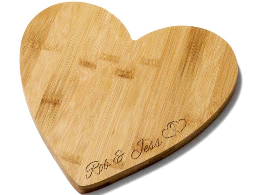 Heart shaped bamboo board. Engraved with a couple's name. Perfect wedding gift.