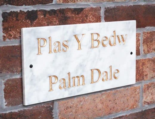 Marble House Sign on a brick wall