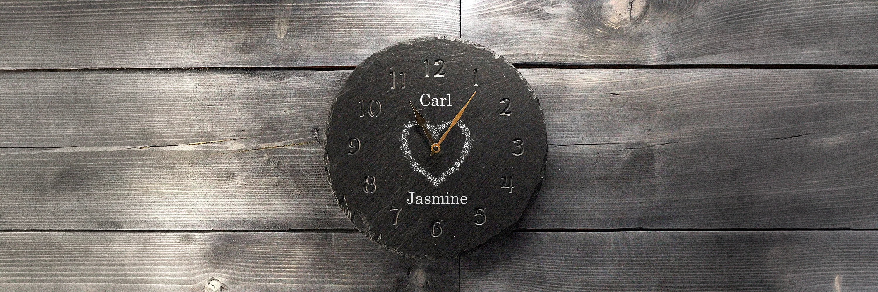 Round Slate Clock with Personalised Writing and Motif Engraved on to it.