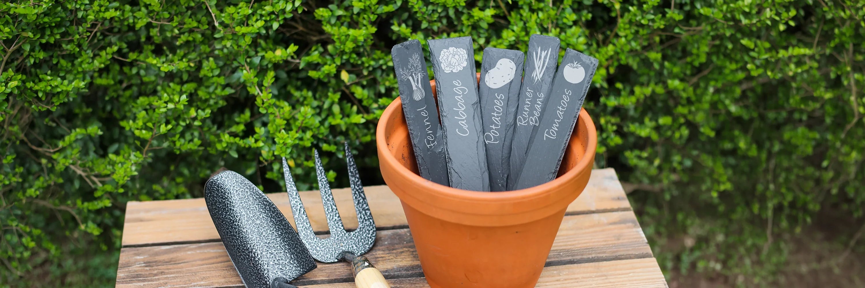 Slate plant markers with various Vegtables and Fruit Engraved onto them
