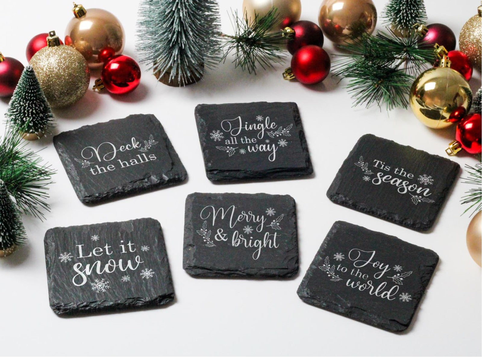 Set of 4welsh slate christmas coaster set with festive quotes on each coaster