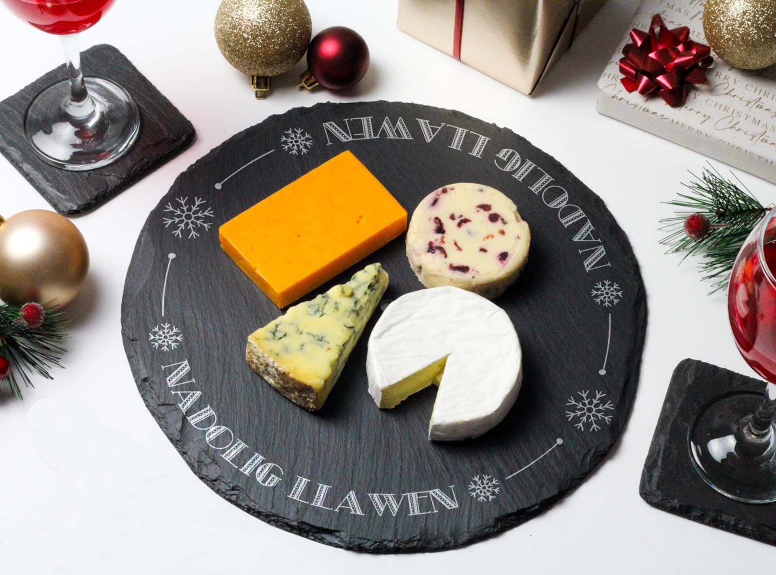 Round welsh slate cheeseboard laser engraved with the words 'Nadolig Llawen'
