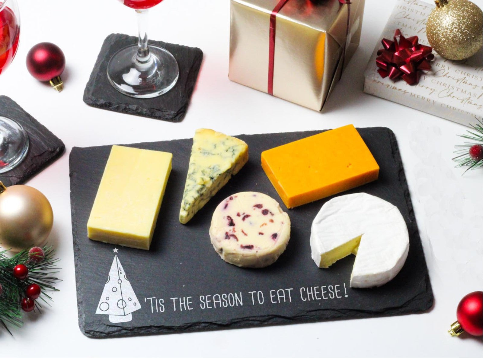 Welsh slate rectangle Christmas cheeseboard with words 'tis the season to eat cheese'