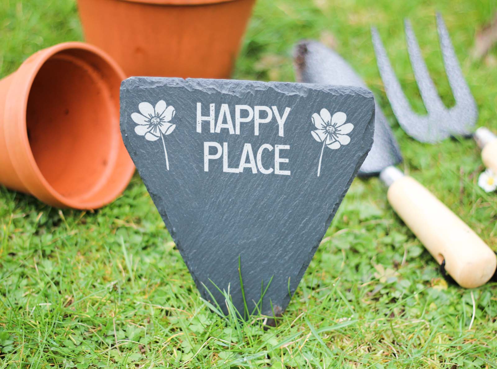 hand cut welsh slate garden marker engraved with 'Happy place'