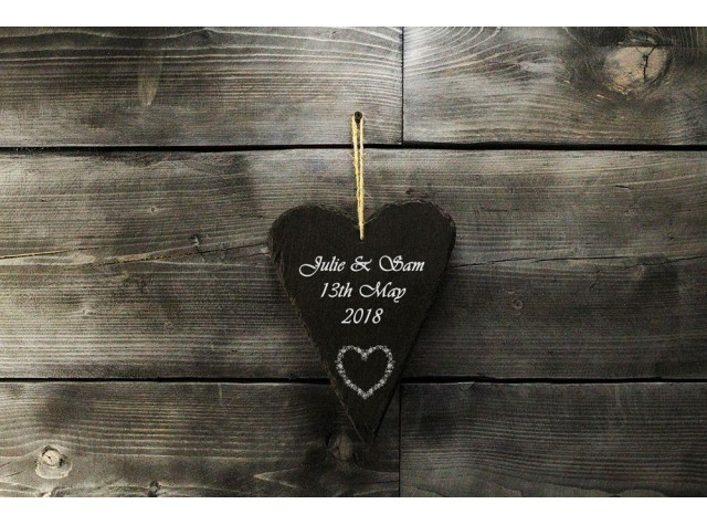 Welsh slate heart shaped hanging sign engraved with the words love laughter and happily ever after 