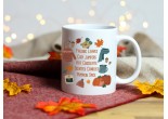 White ceramic mug with a beautiful design of pumpkins, jumpers, candles, cosy scarves, hot chocolate and autumn leaves